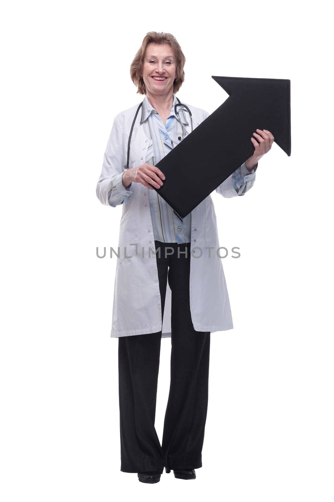 Friendly senior medical doctor pointing direction with arrow by asdf