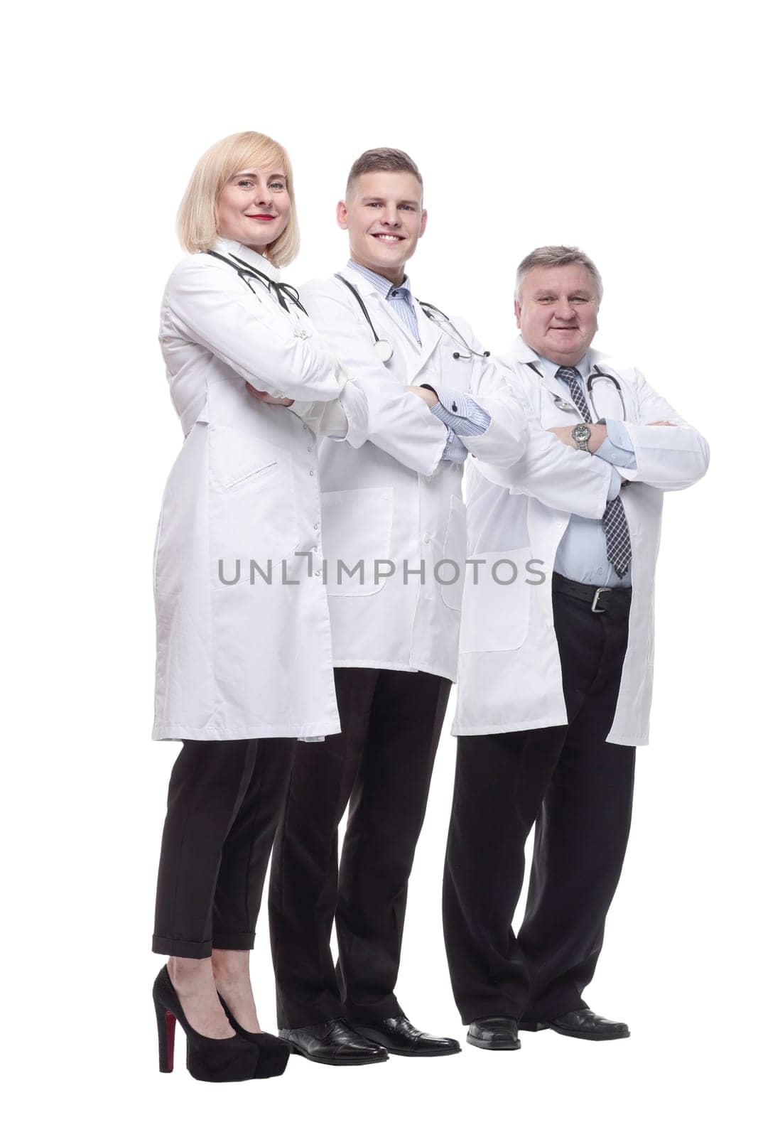in full growth.qualified doctors colleagues standing in a row. isolated on a white background.