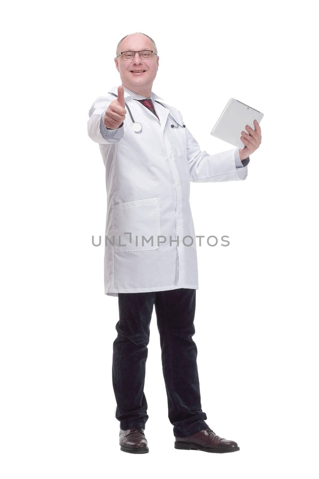 in full growth. modern mature doctor with a digital tablet. isolated on a white background.