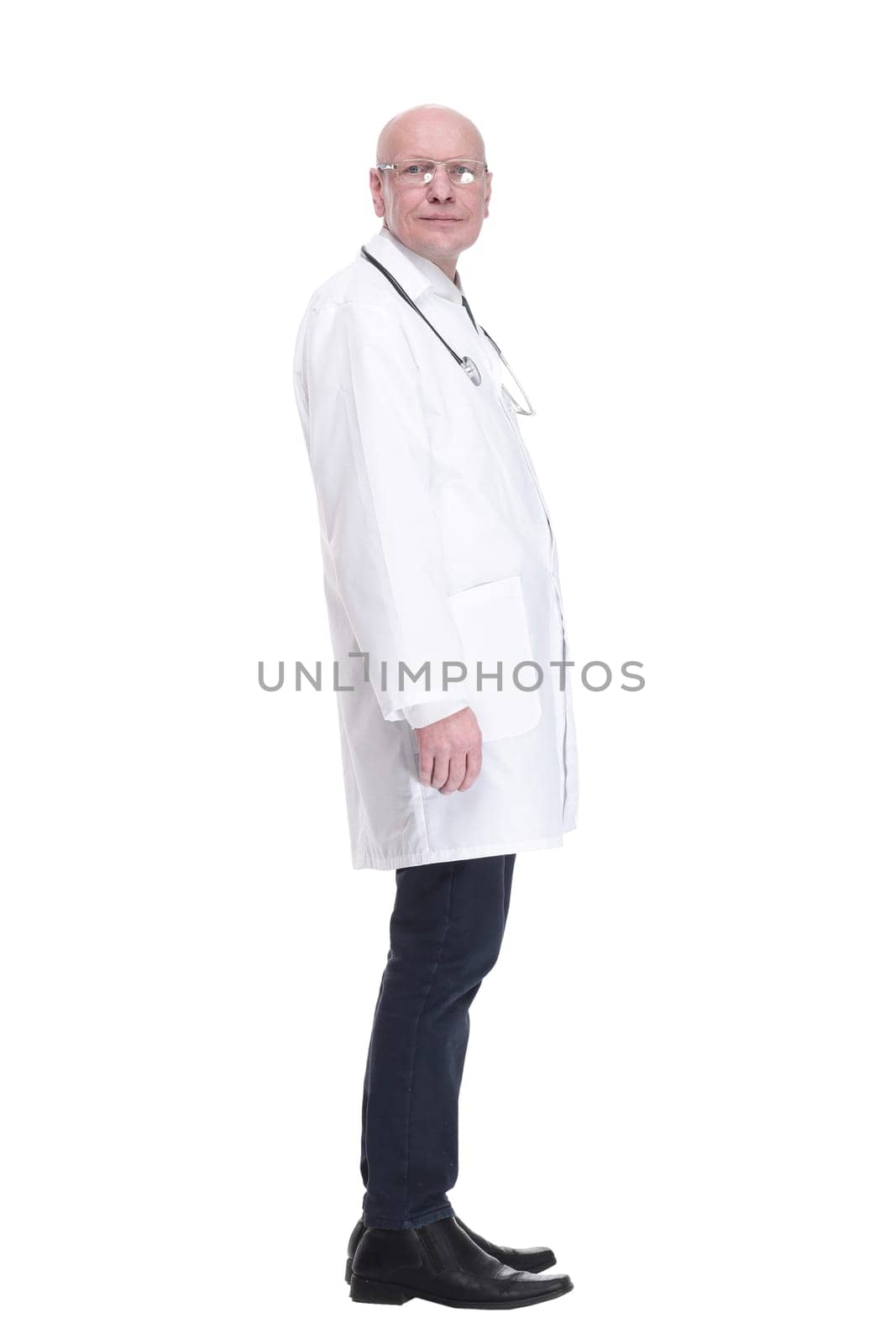 side view.a serious doctor with a stethoscope looking at you . isolated on a white background.
