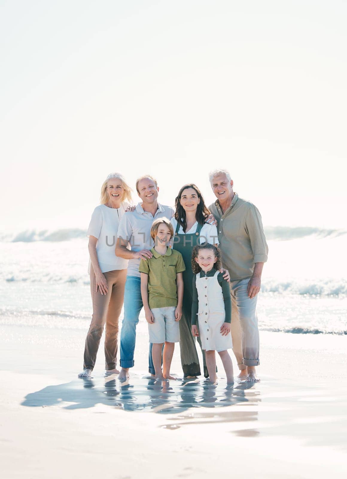 Happy, beach and portrait of family generations together on vacation, holiday or tropical weekend trip. Smile, travel and children with parents and grandparents bonding by the ocean in Australia. by YuriArcurs