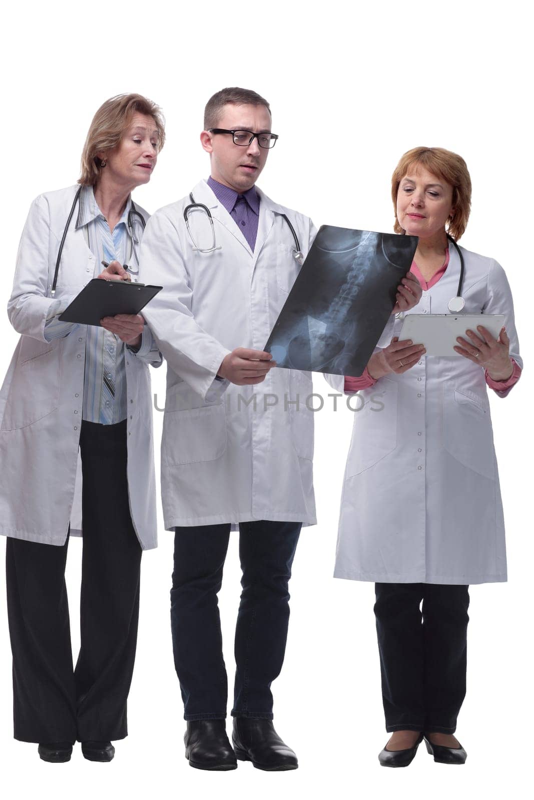 Medical team discussing diagnosis of x-ray image by asdf