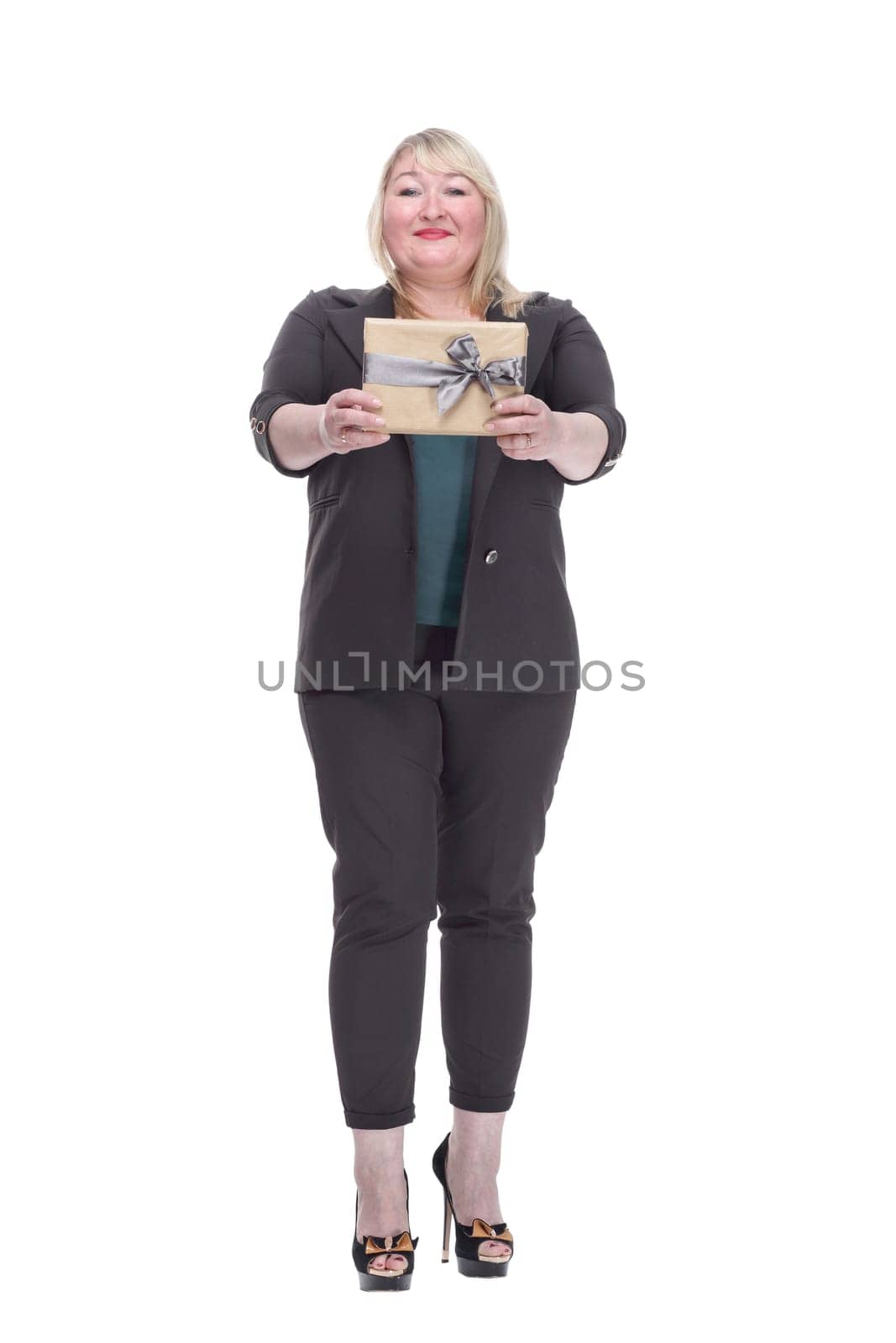 in full growth. attractive mature woman with gift box. isolated on a white background.