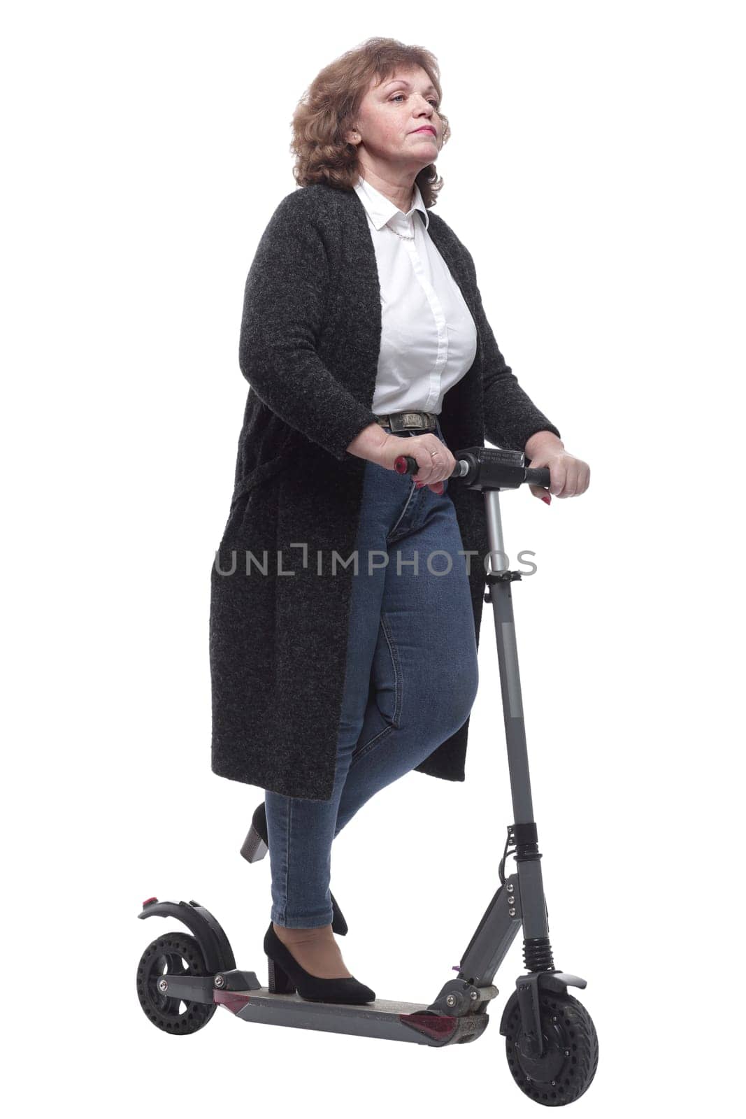 in full growth. confident adult woman with an electric scooter. isolated on a white background