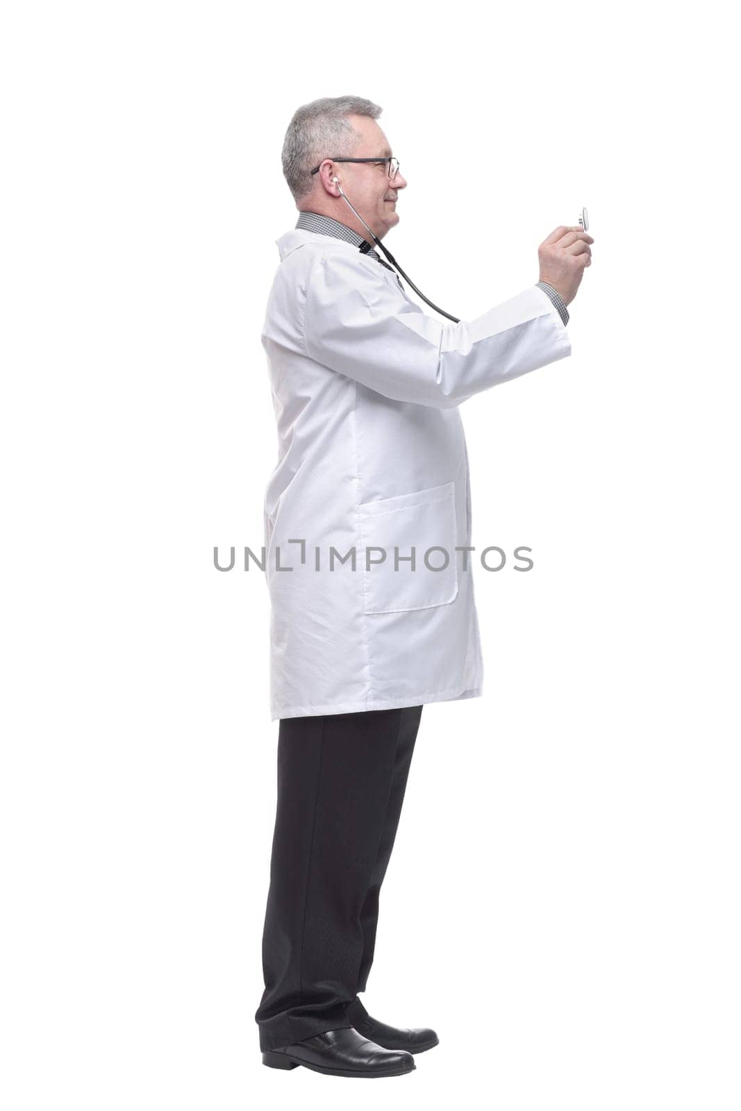 Side view of a friendly elderly doctor with stethoscope by asdf