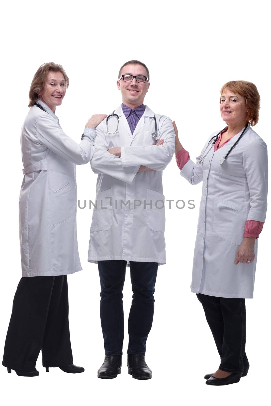 Attractive male doctor standing in front of medical group by asdf