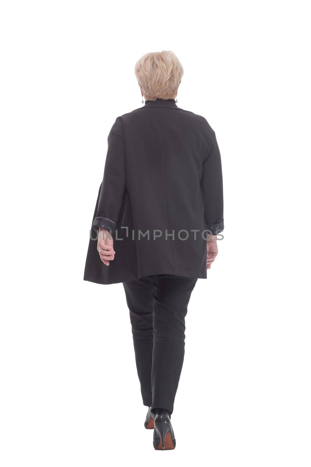 in full growth.confident business woman striding forward. isolated on a white background.