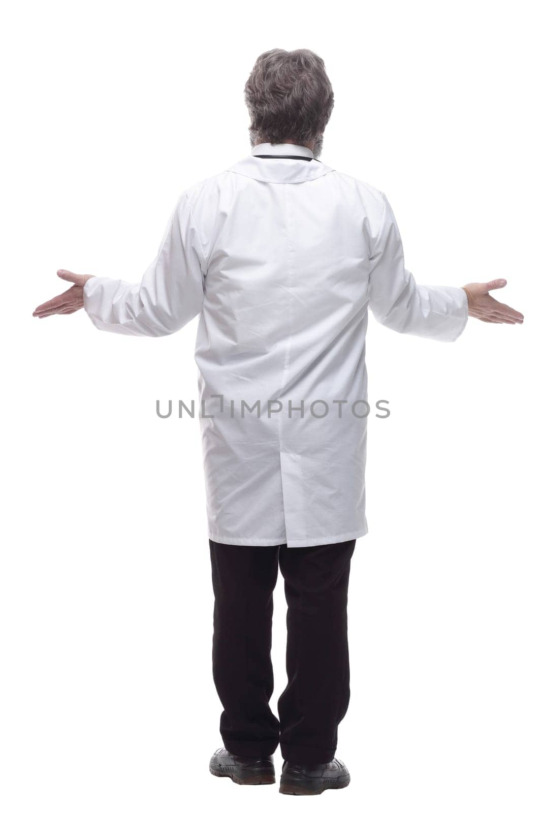 rear view. senior doctor reading an ad on a large white screen. isolated on a white