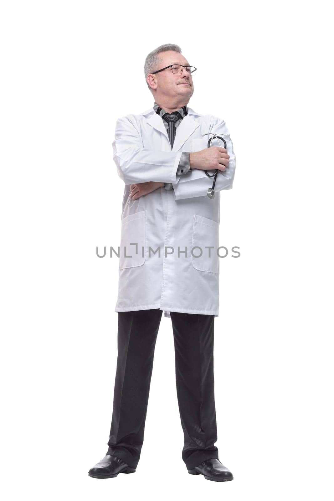 Portrait of smiling mature doctor holding of stethoscope and looking at camera isolated on white background