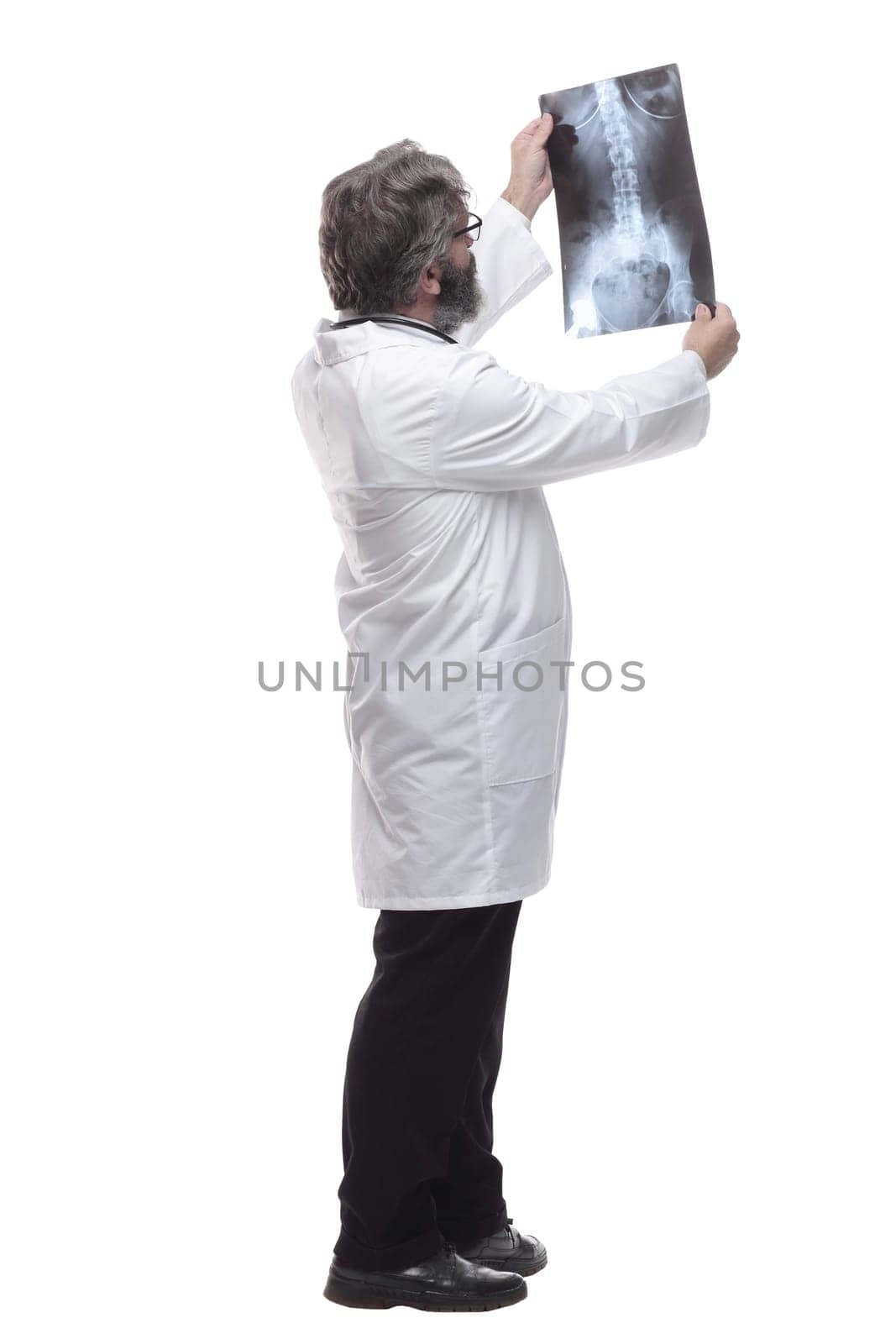 attending doctor examining an x-ray of the lungs. isolated on a white by asdf