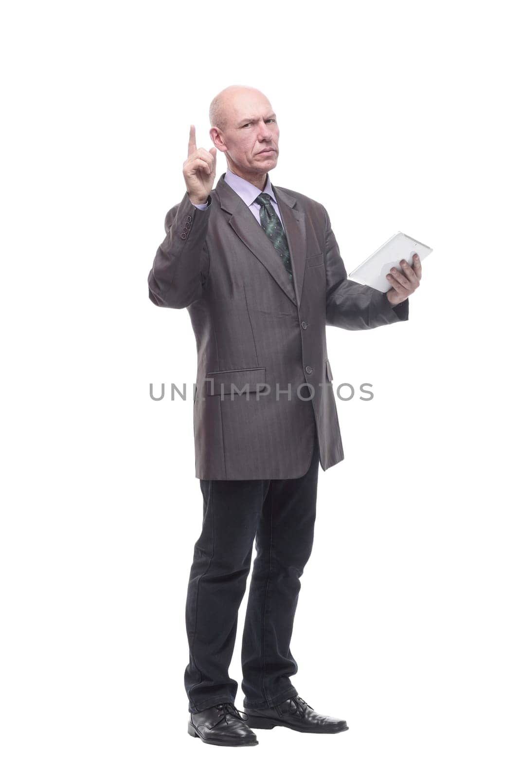 smiling business man with a digital tablet. isolated on a white background.