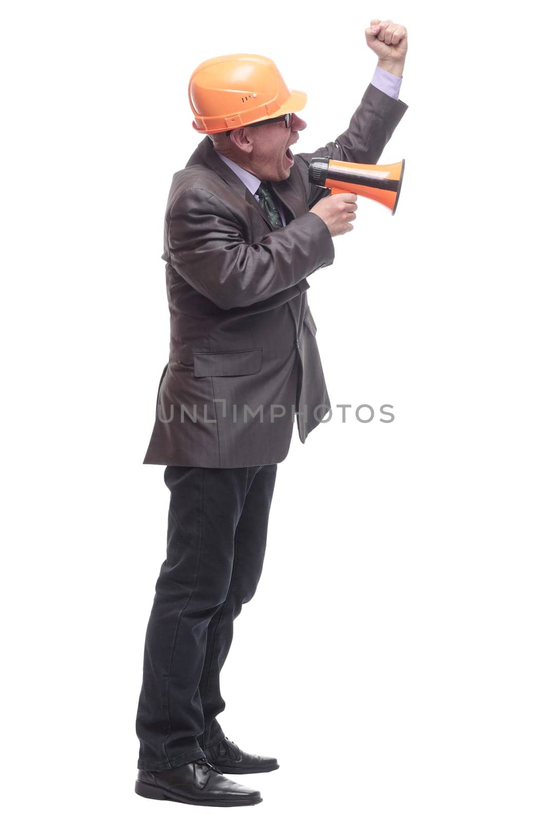 business man in a protective helmet with a megaphone. isolated on a white background.