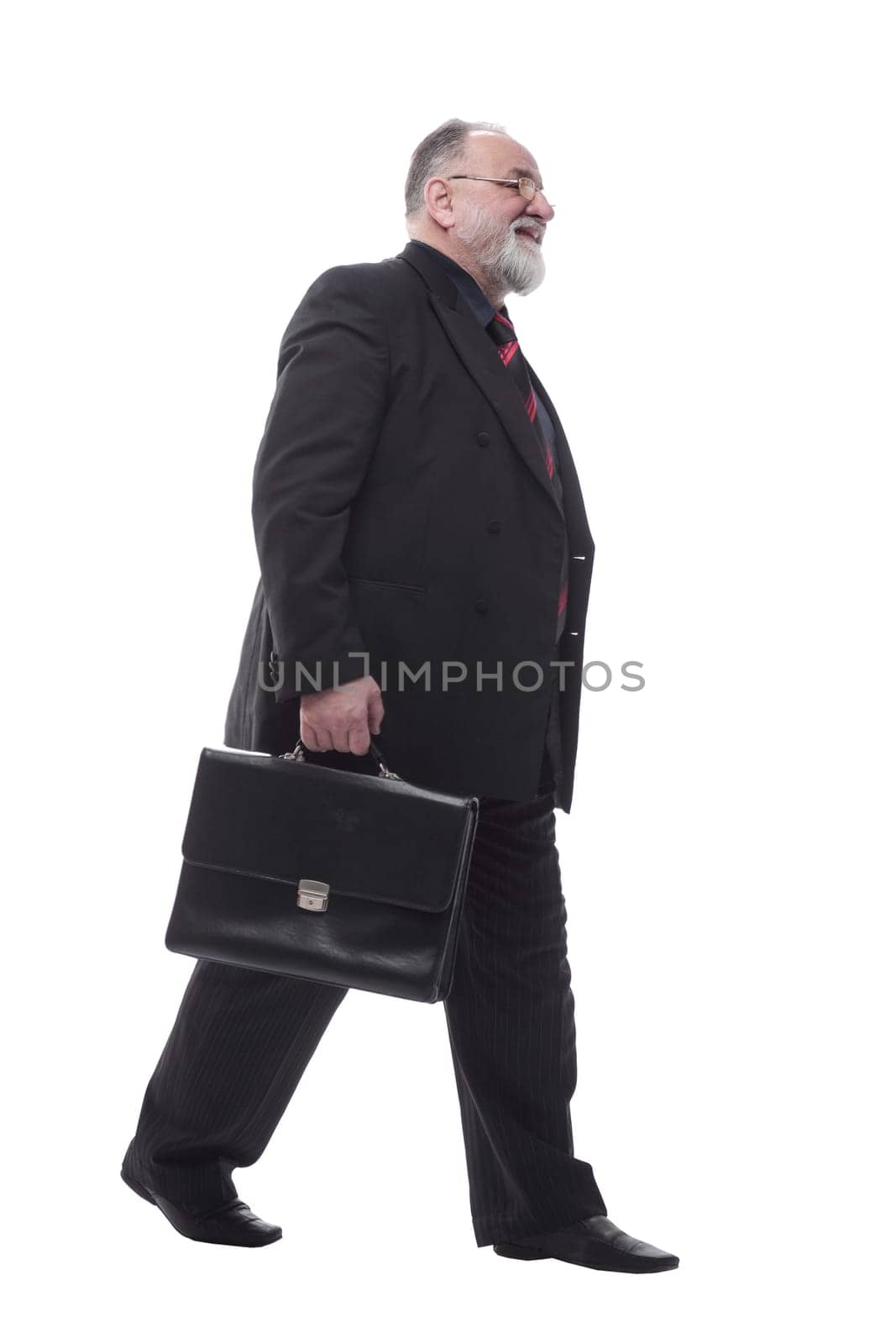 business man with a briefcase walking forward. isolated on a white by asdf