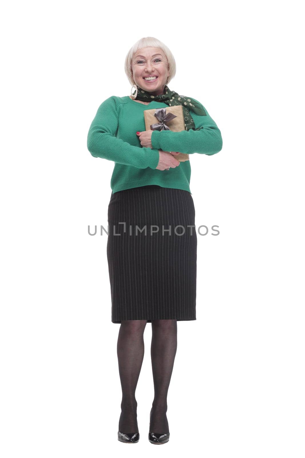 in full growth.happy woman with a gift box. isolated on a white background.