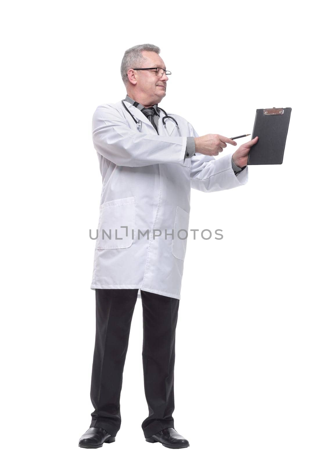 Smiling happy mature doctor showing empty clipboard to write it on your personal advice, isolated on white background