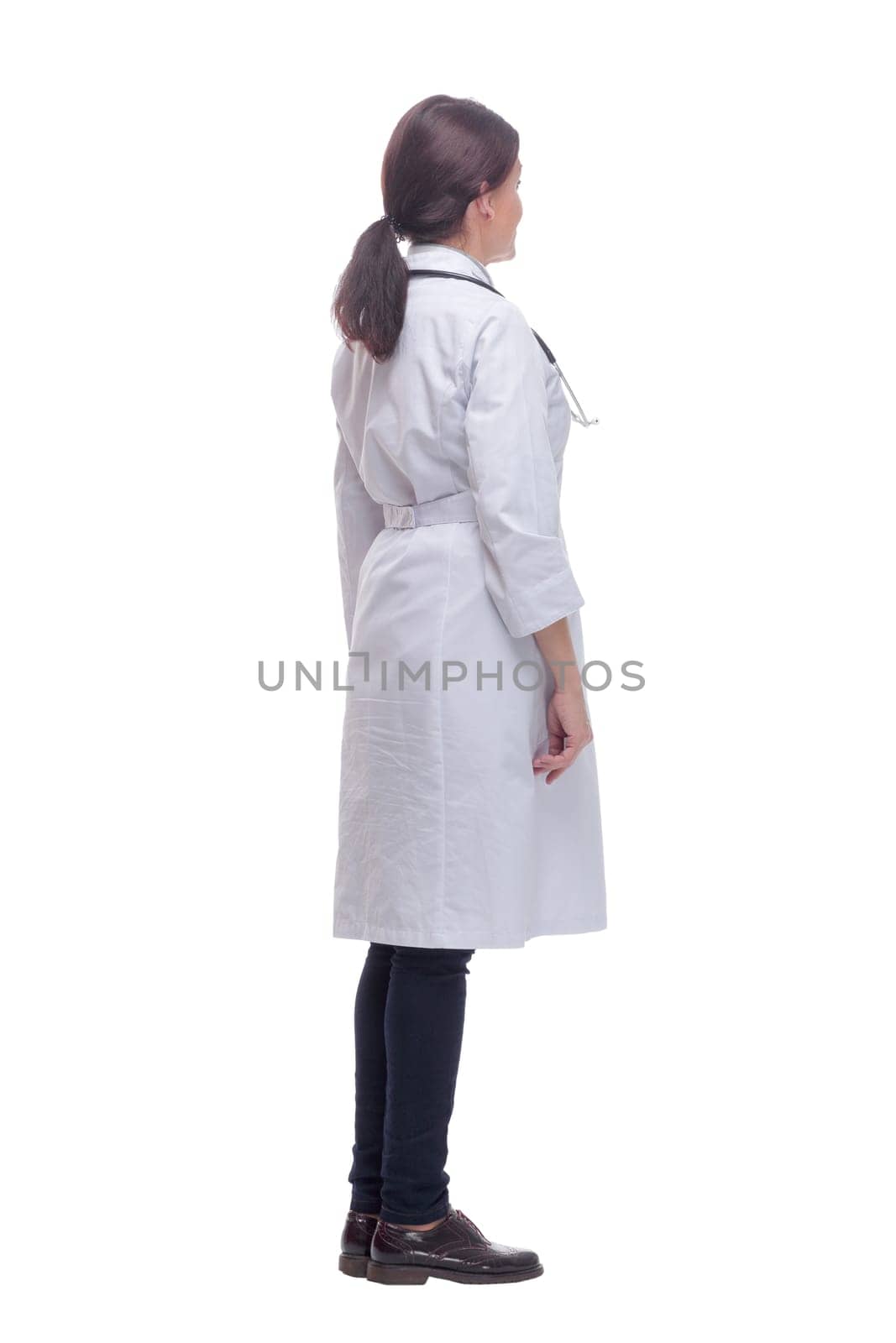 Female health care worker from the back - looking at something by asdf