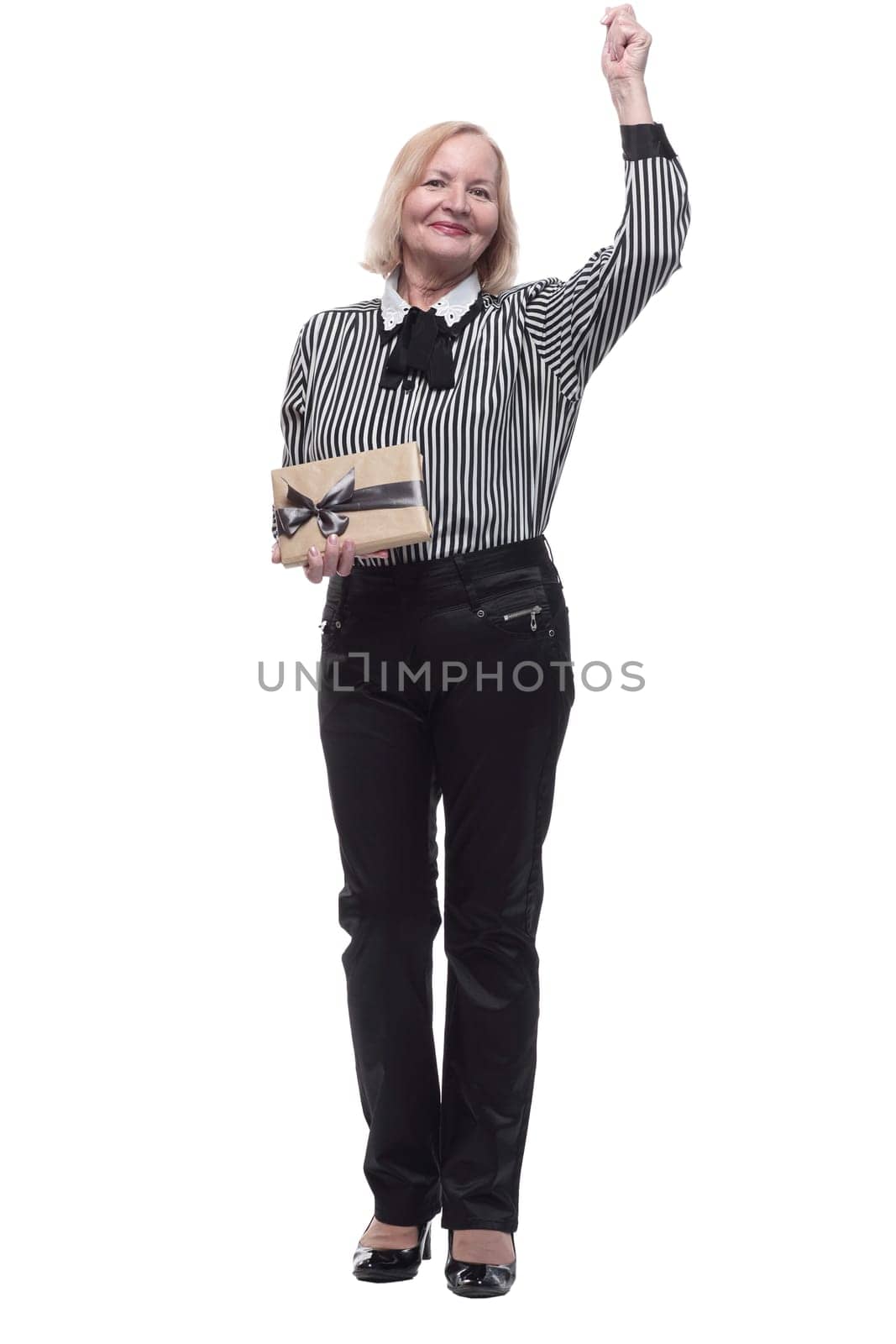 in full growth. Mature business woman with gift box . isolated on a white background.