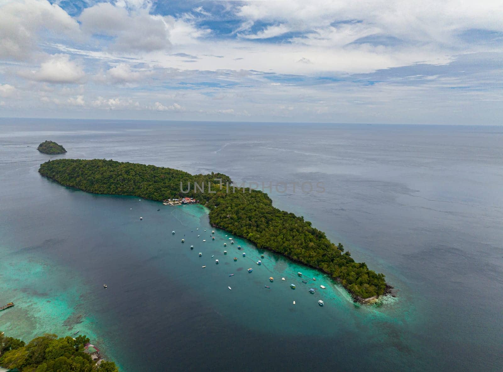 Aerial view of Rubiah island with jungle and blue sea. Aceh, Indonesia.