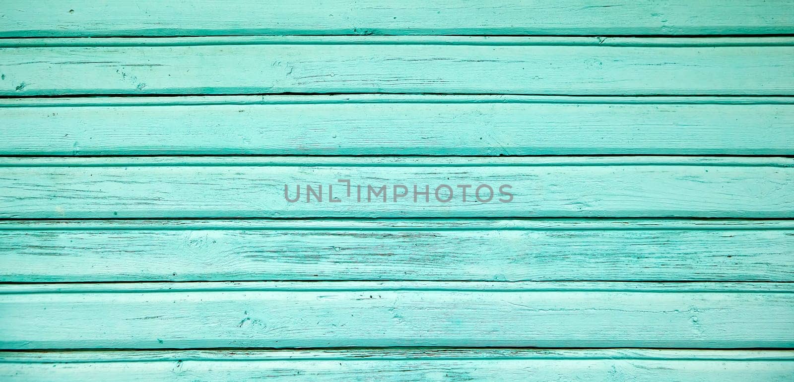 wood trim home turquoise background image, vintage, turquoise wood veneer, in daylight.