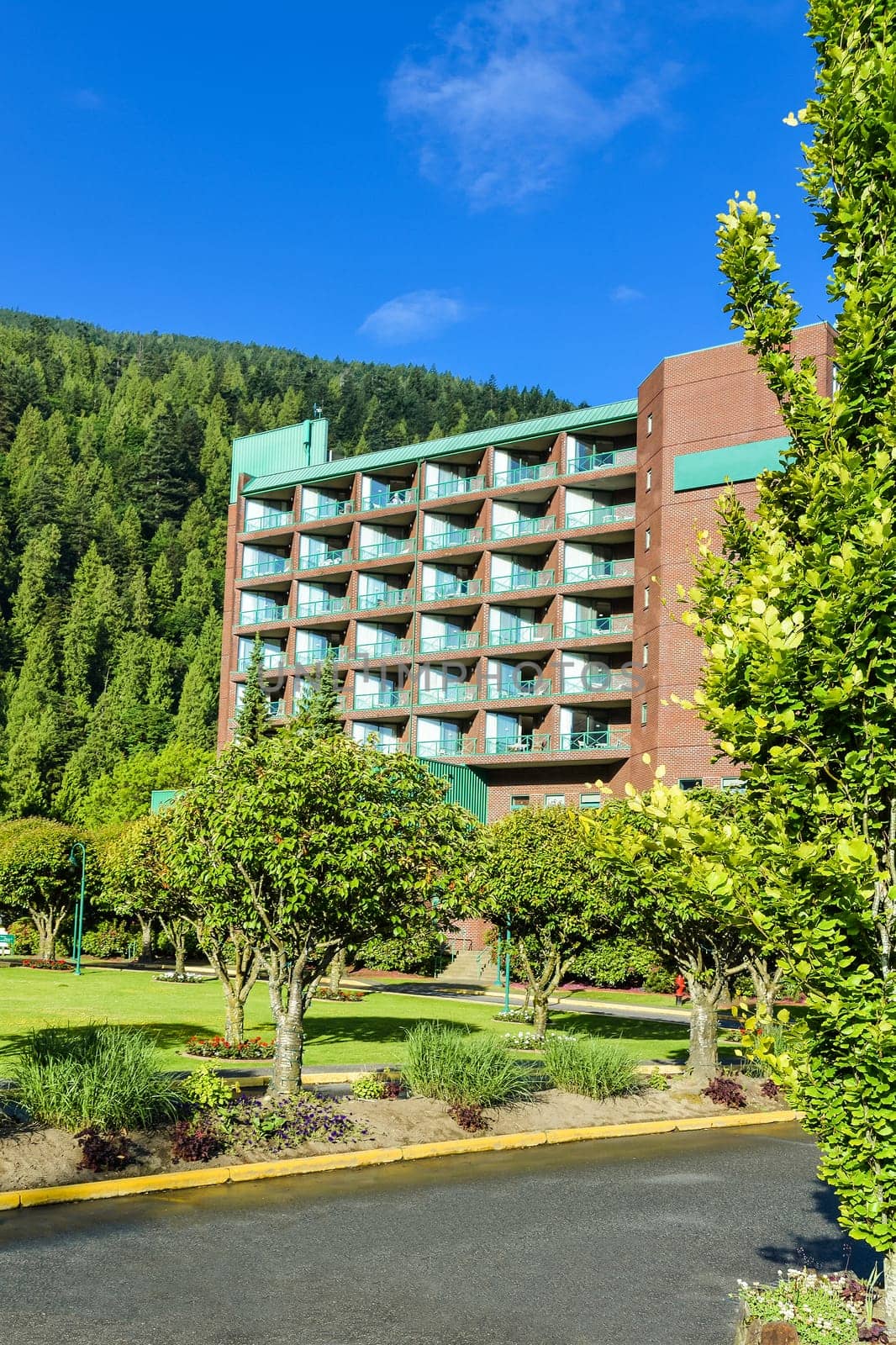 Resort building with mounting view and blue sky background.