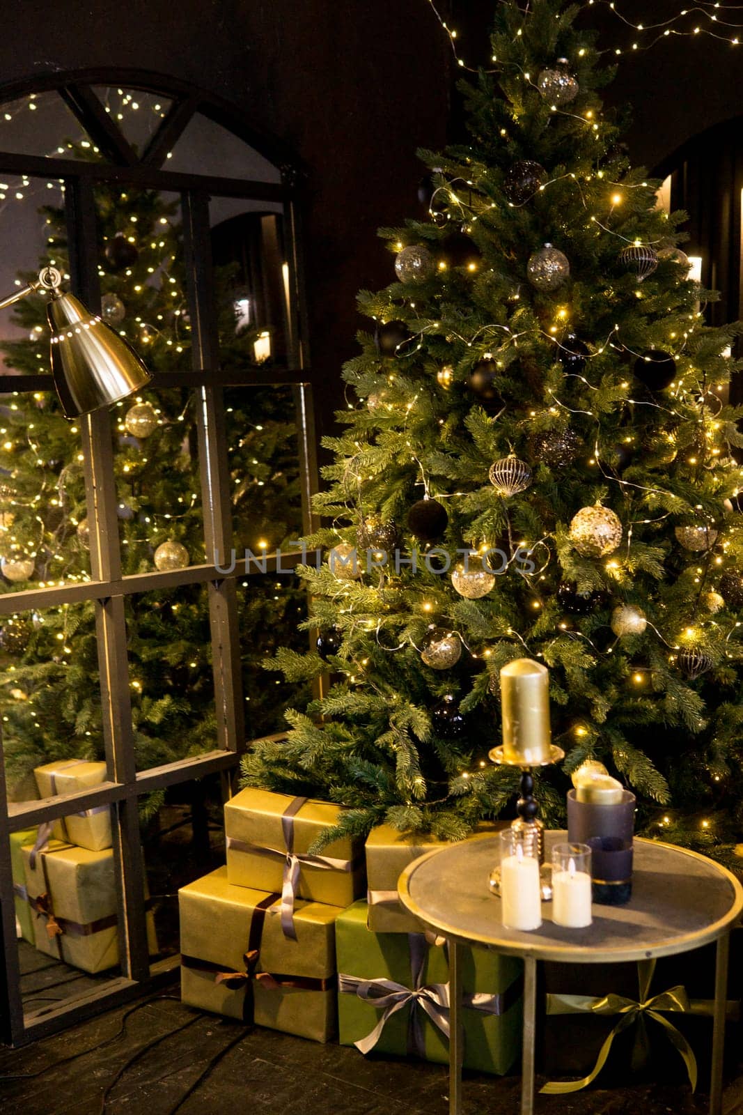 Christmas interior with a beautiful Christmas tree, light bulbs and dark background