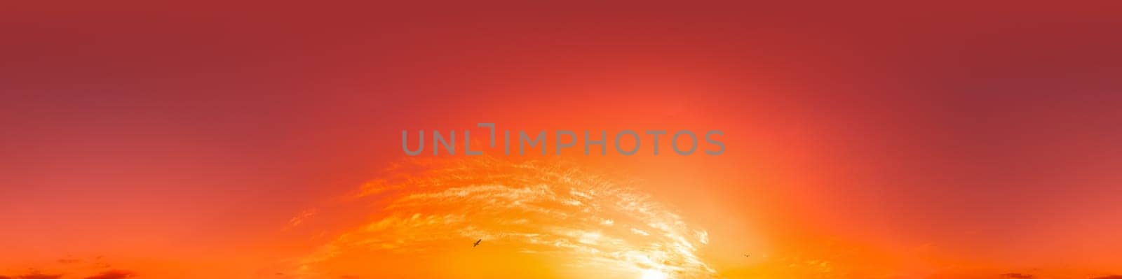 Dramatic Sunset sky 360 panorama. Vibrant sky with bright glowing red pink Cumulus clouds. HDR 360 seamless spherical panorama. Sky dome for aerial drone panoramas. Climate and weather change