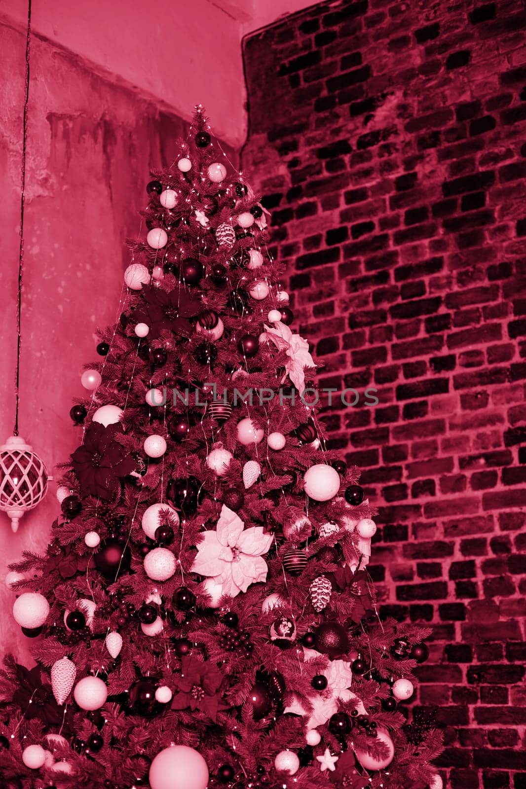 Christmas composition. Lots of silver Christmas tree decorations, top view. Color Viva Magenta. Demonstrating the colors of 2023.