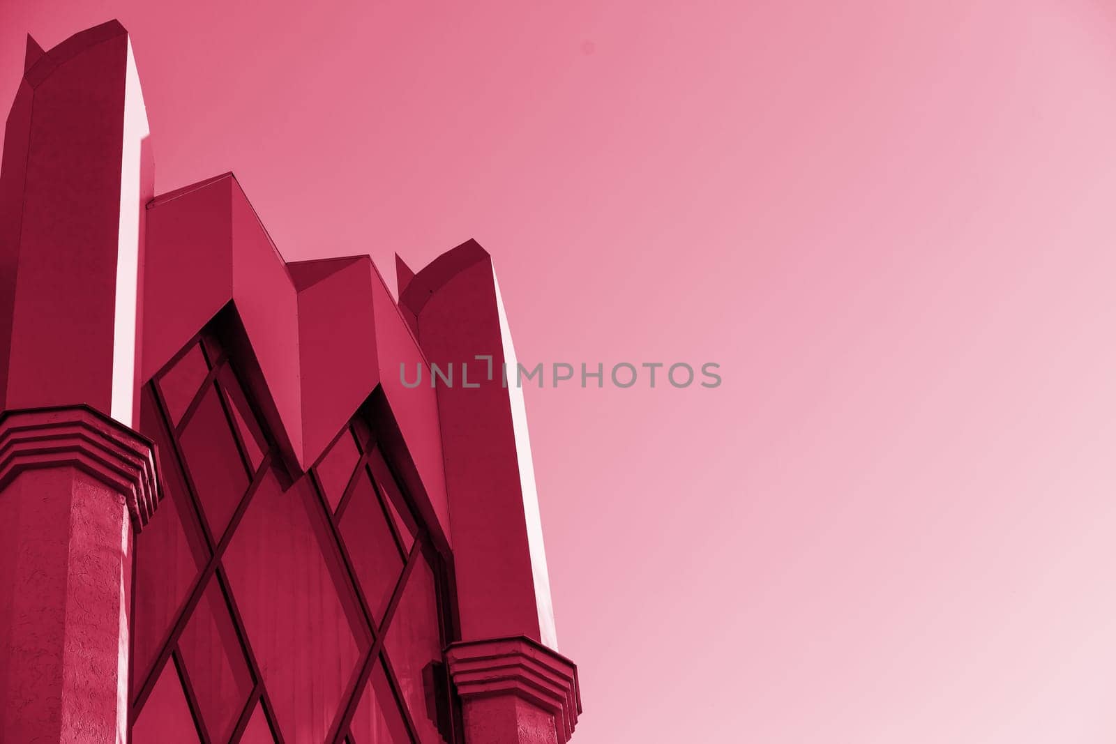 Glass modern building, skyscrapers. A simple architectural form against the sky.Fragments of modern urban architecture.