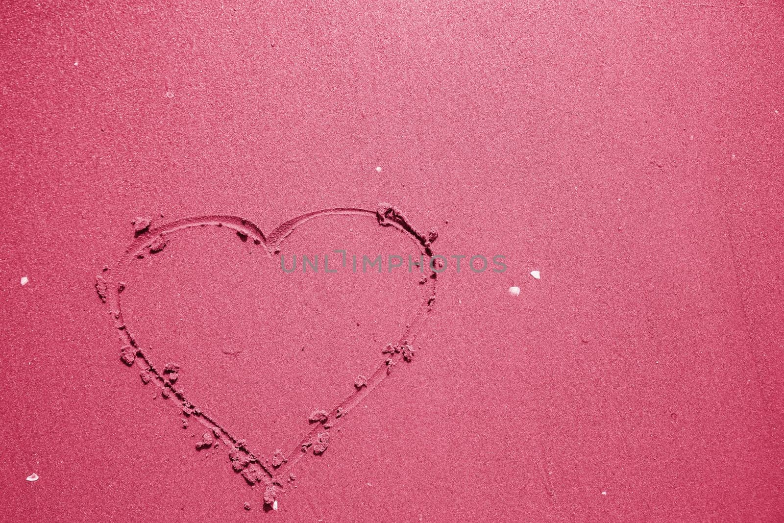 Heart drawn in the sand. Beach background. Top view