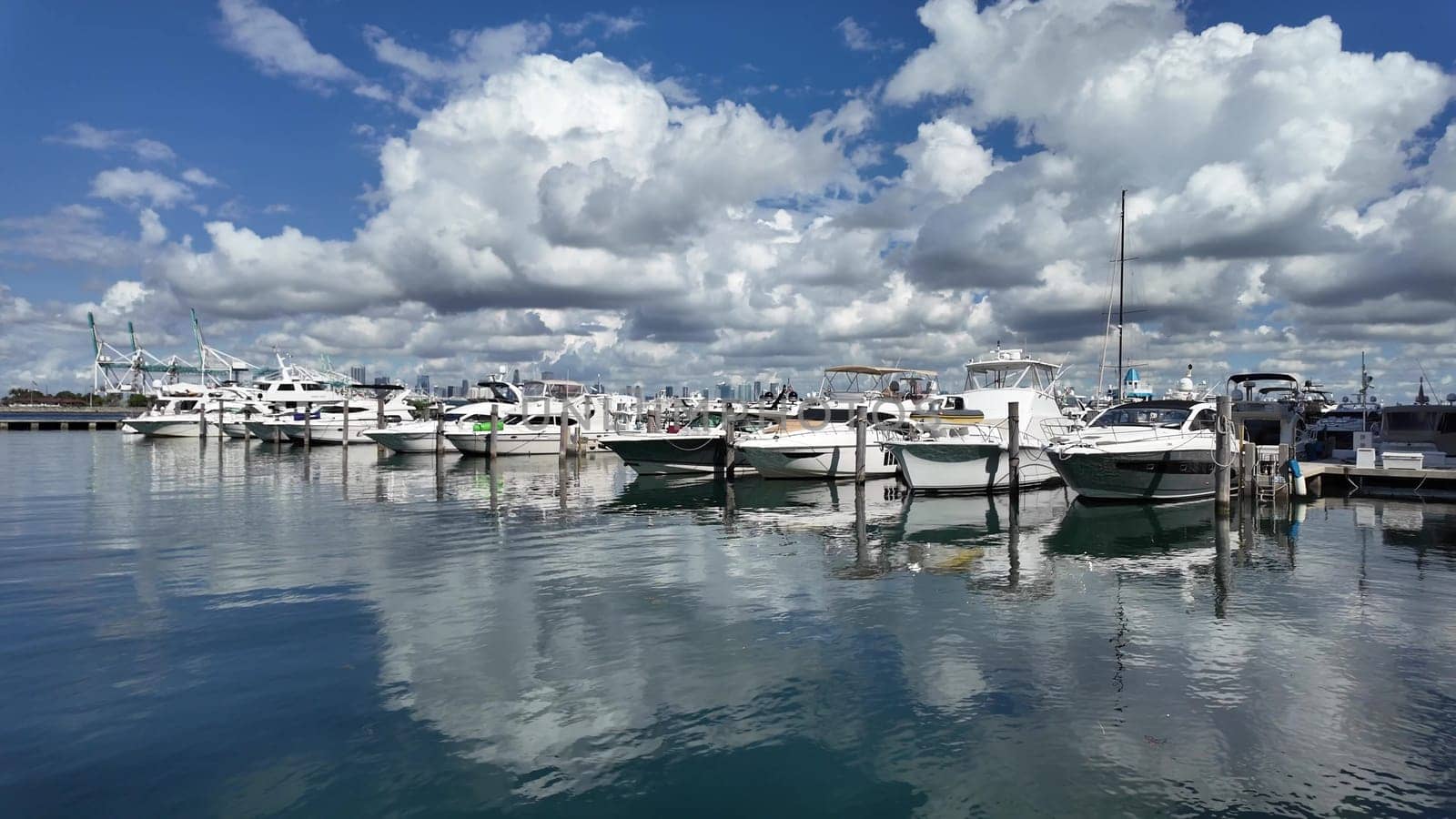 Yacht in navigation. Private luxury boat anchored off Miami beach. Summer boat vacation. Miami yachting. Yacht vacation in summer. Marina bay. Luxury motor yacht in sea marina bay. Biscayne bay.