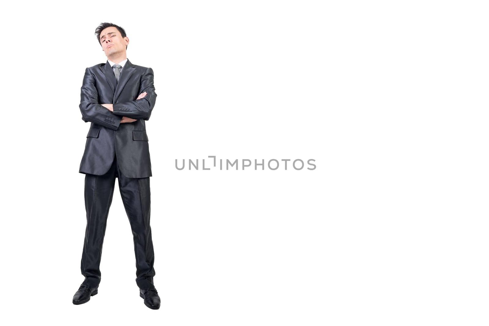 Full body of over proud male in formal suit looking at camera with crossed arms isolated on white background in studio