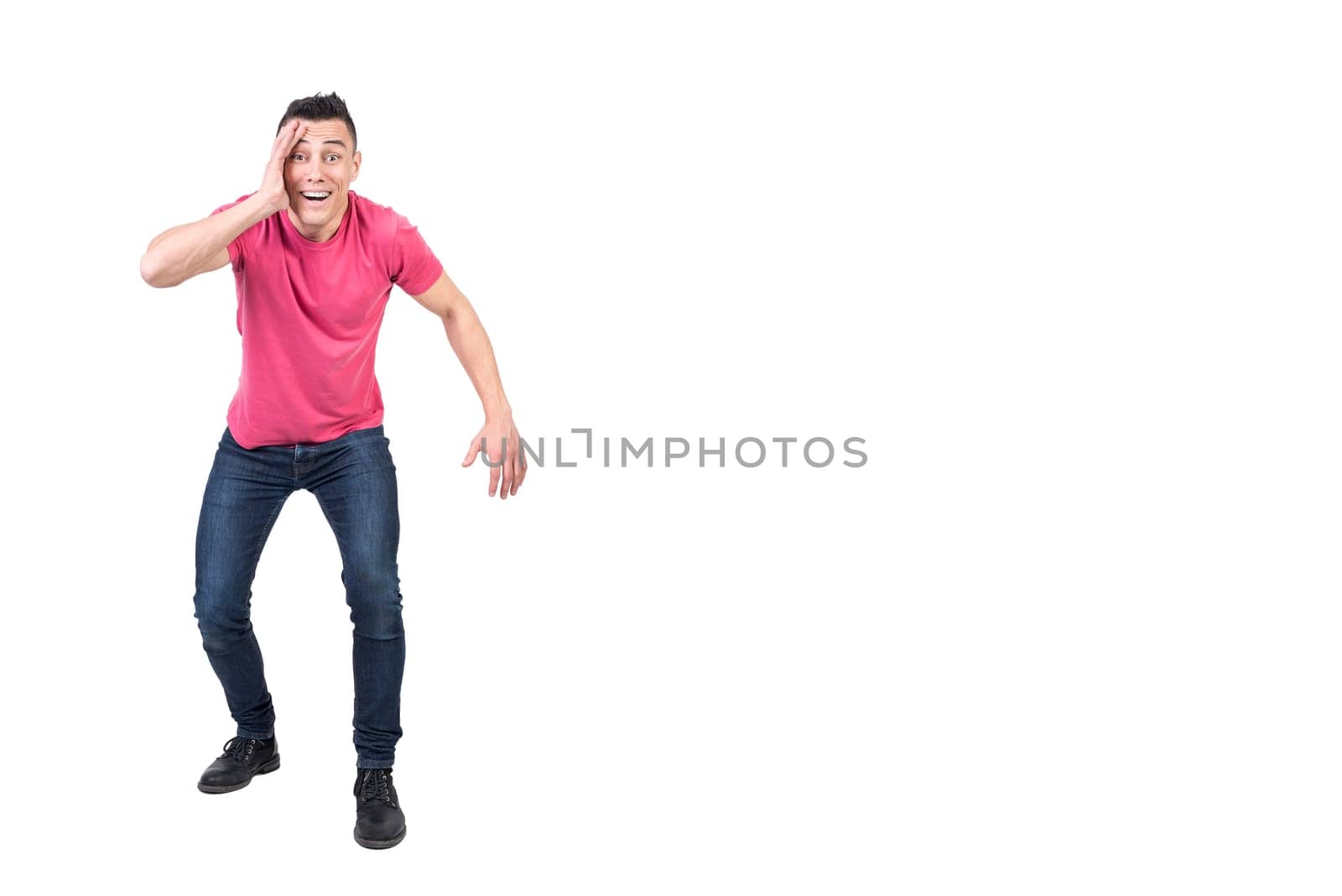 Full body of shocked male with hand in face looking at camera with amazed face isolated on white background in studio