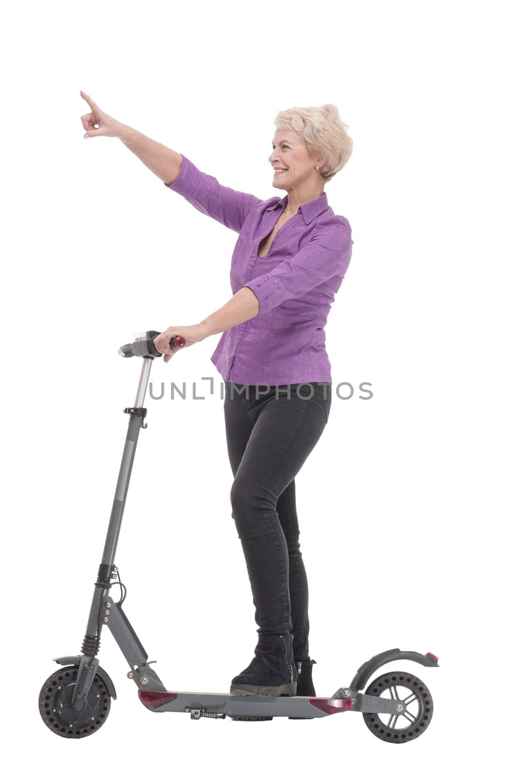 smiling mature woman with an electric scooter . by asdf