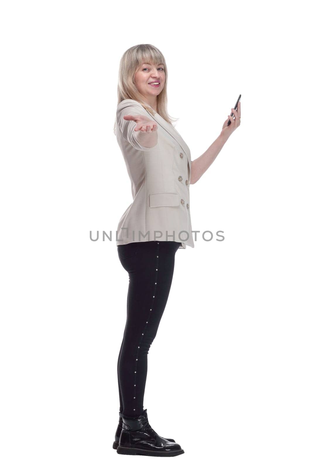 side view. casual woman choosing the right contact on her smartphone. isolated on a white background.