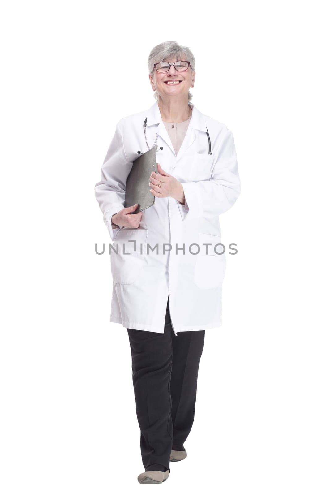 in full growth.confident female medic with clipboard looking at you. isolated on white background.