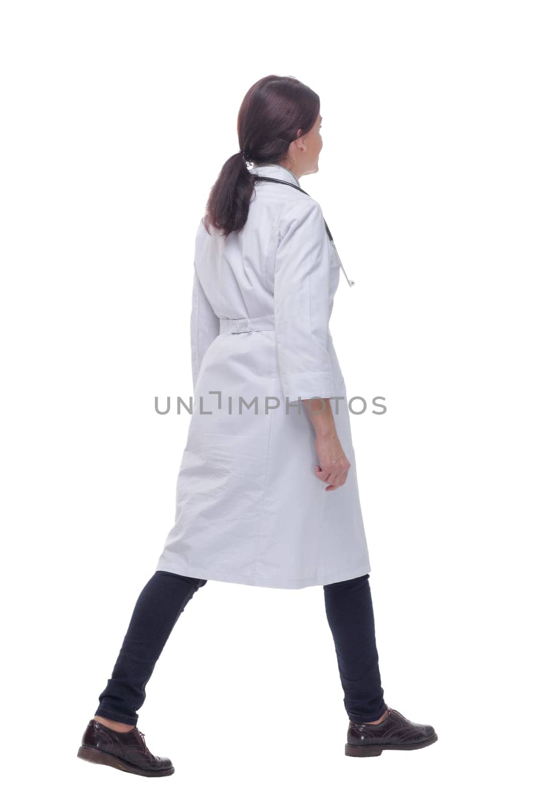 Confident medical doctor woman stepping forward. isolated on white