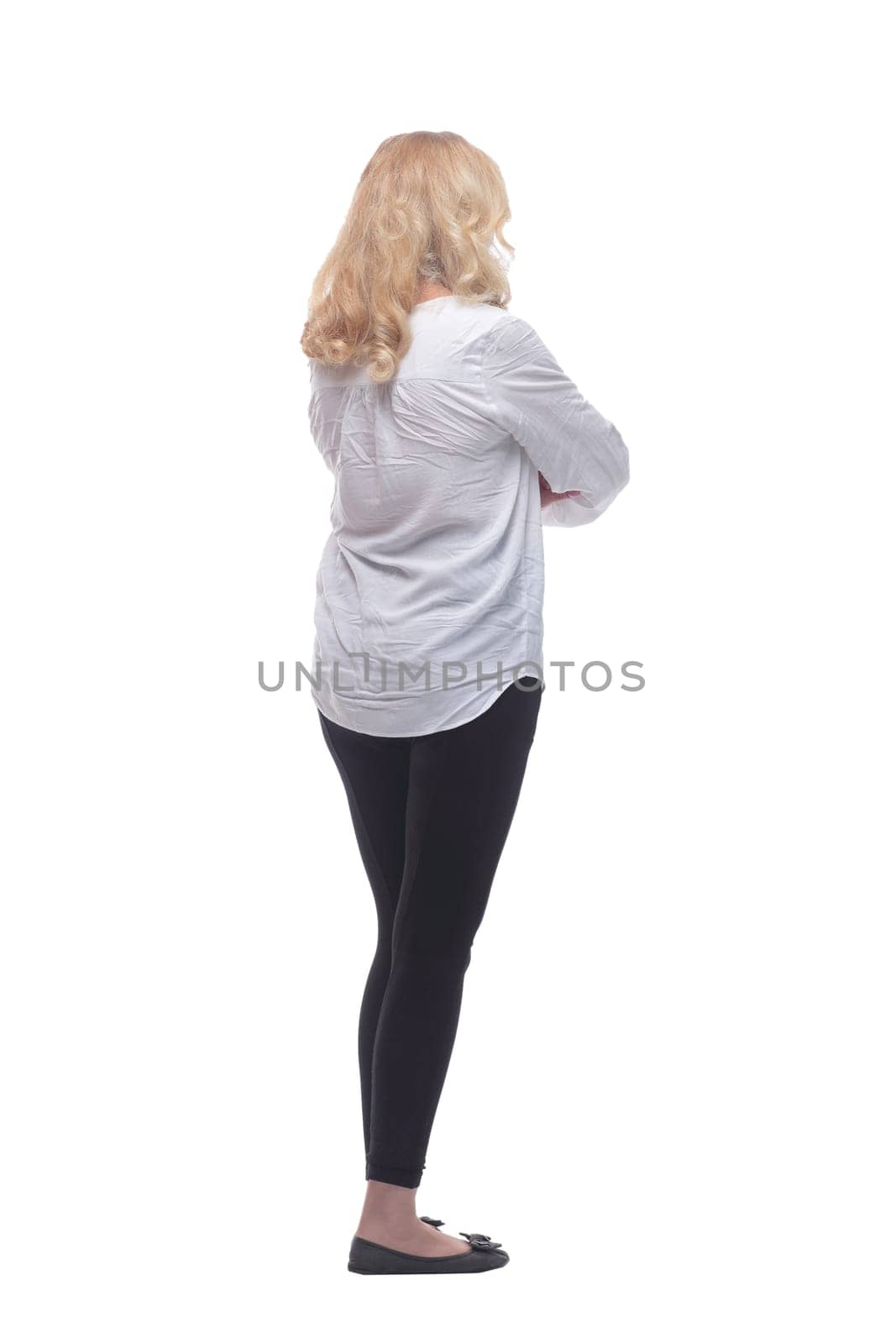 rear view. casual woman in a white blouse reading an ad on a white screen. isolated on a white background.