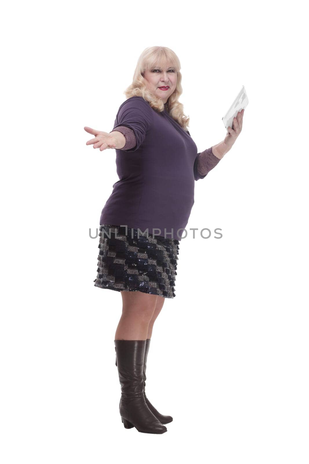 full-length. casual mature woman with a digital tablet . isolated on a white background.