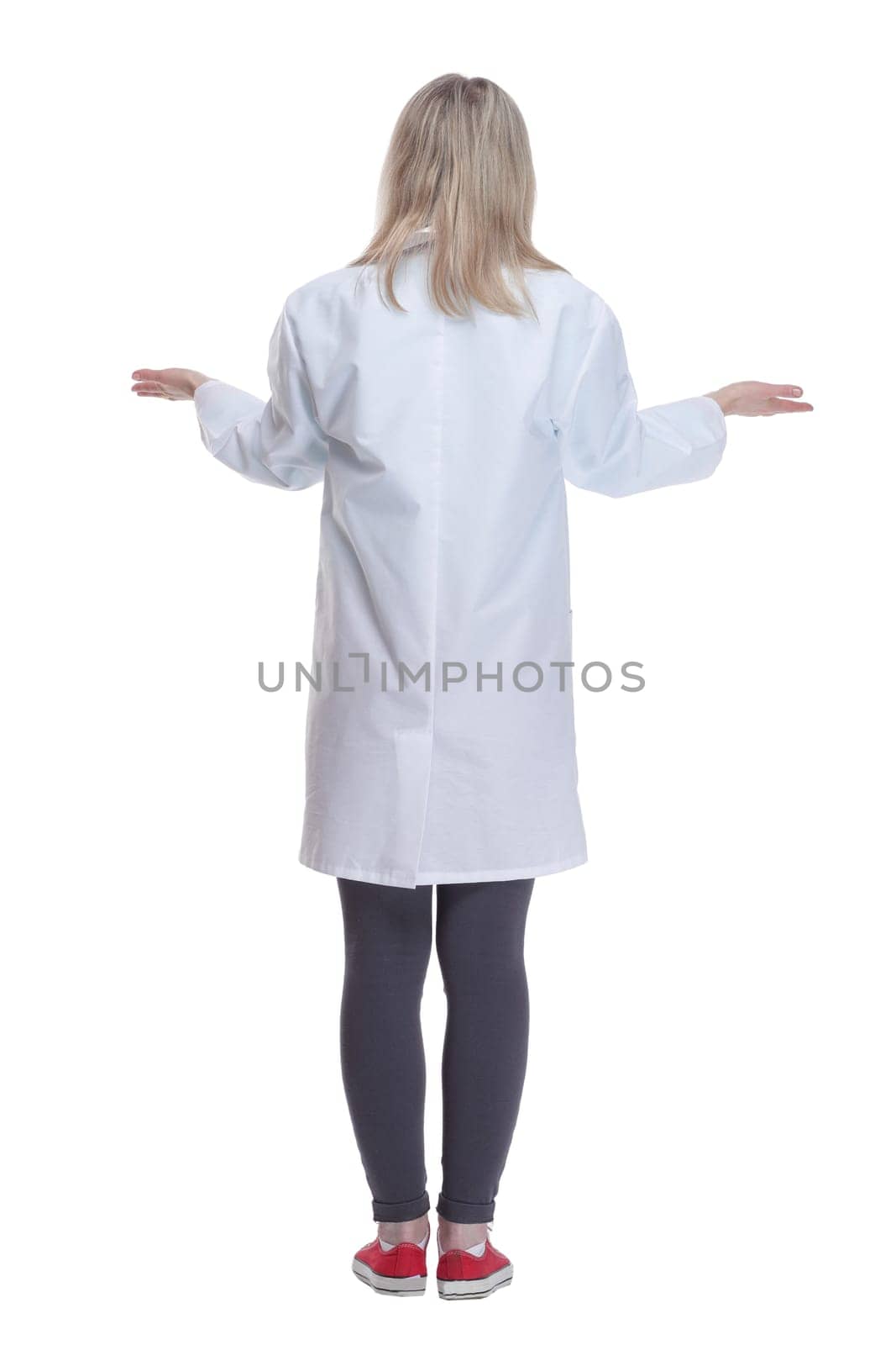 rear view.female medic looking at a white screen . isolated on a white background.