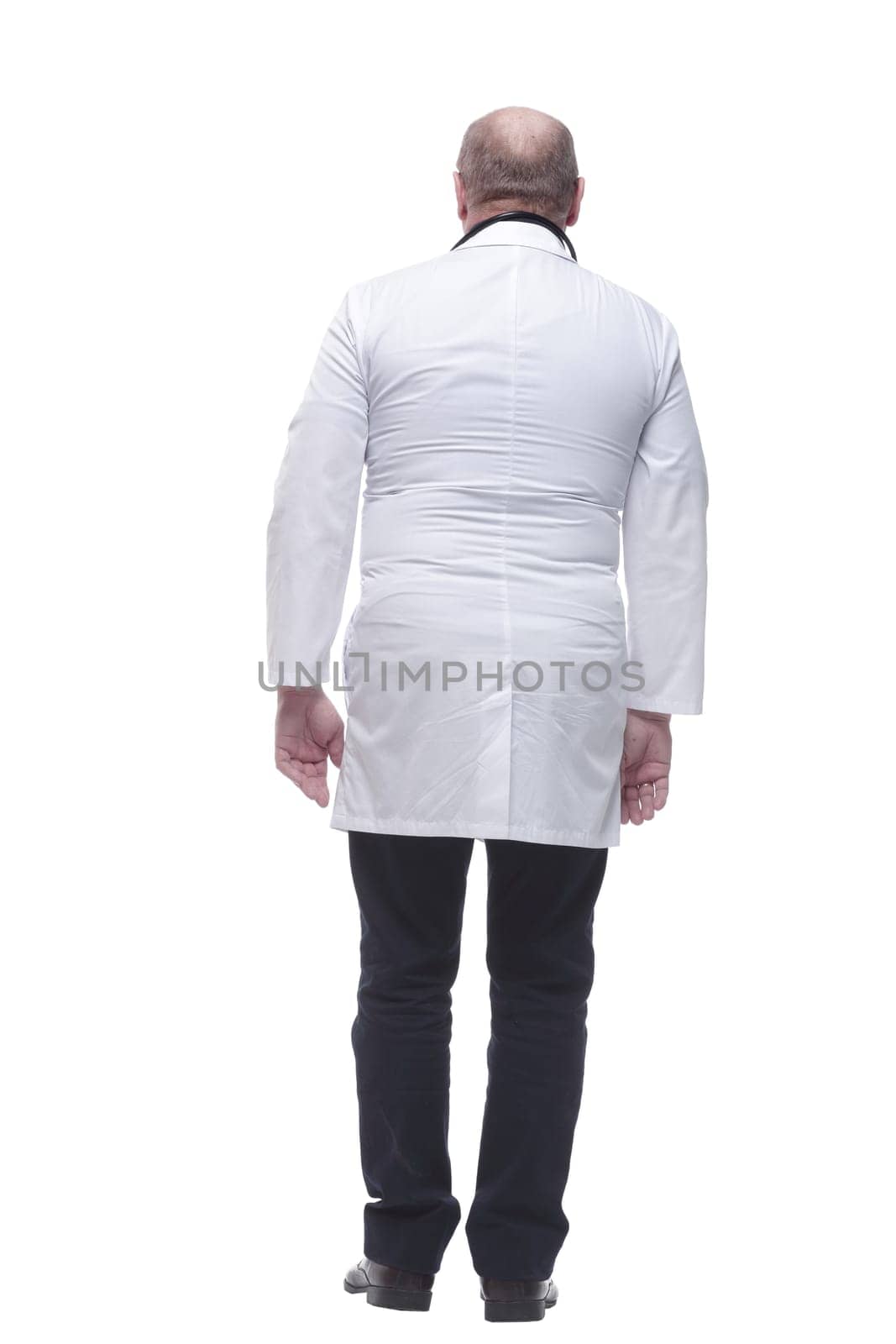 rear view. doctor-therapist reading an ad on a white screen. isolated on a white background