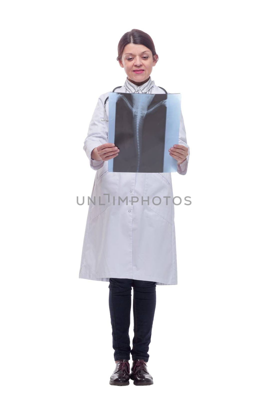 Professional female doctor examining patient's x-ray of human spine ispolated over white background