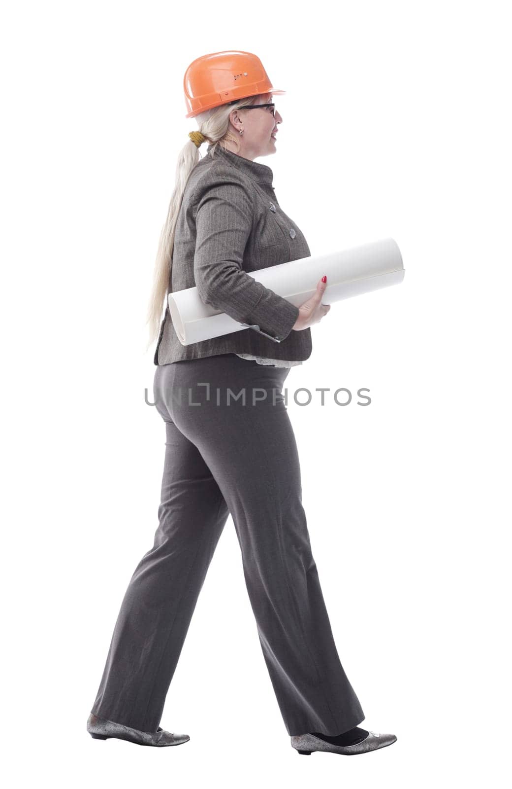 female architect with a roll of drawings striding towards you by asdf