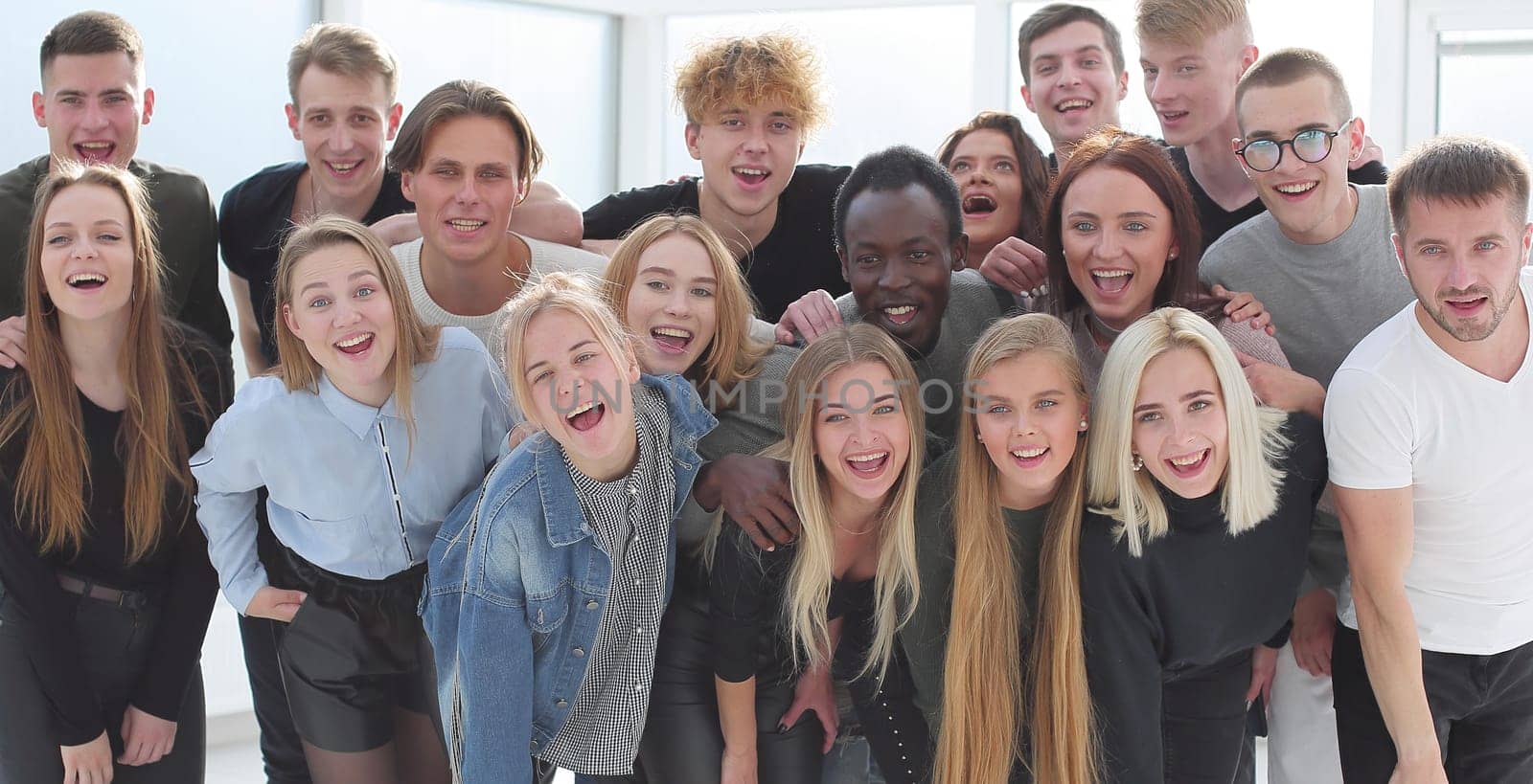portrait of a group of happy young people by asdf