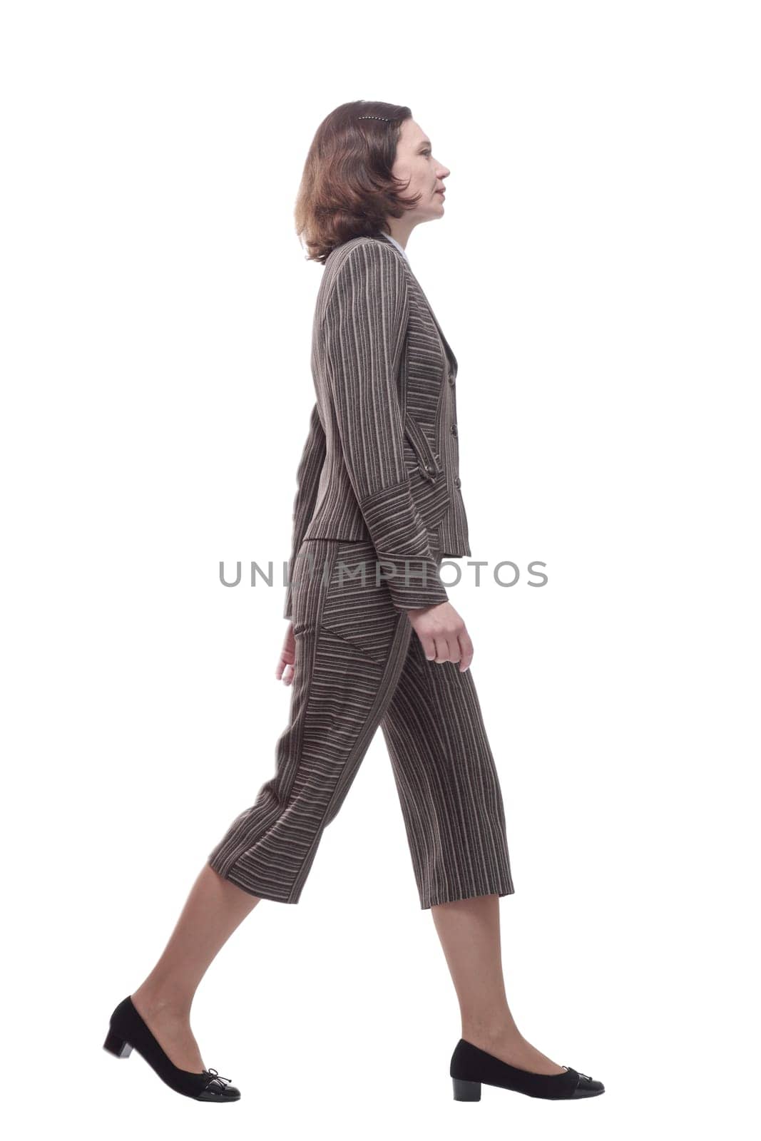 in full growth. modern business woman stepping forward. isolated on a white background.