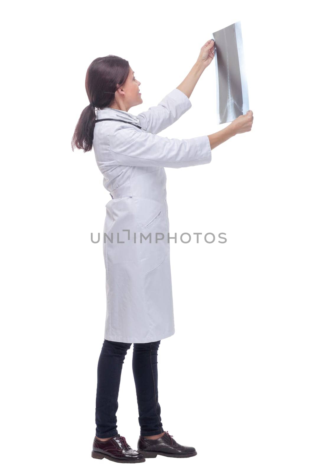 Side view of nice doctor watching a patient x-ray by asdf