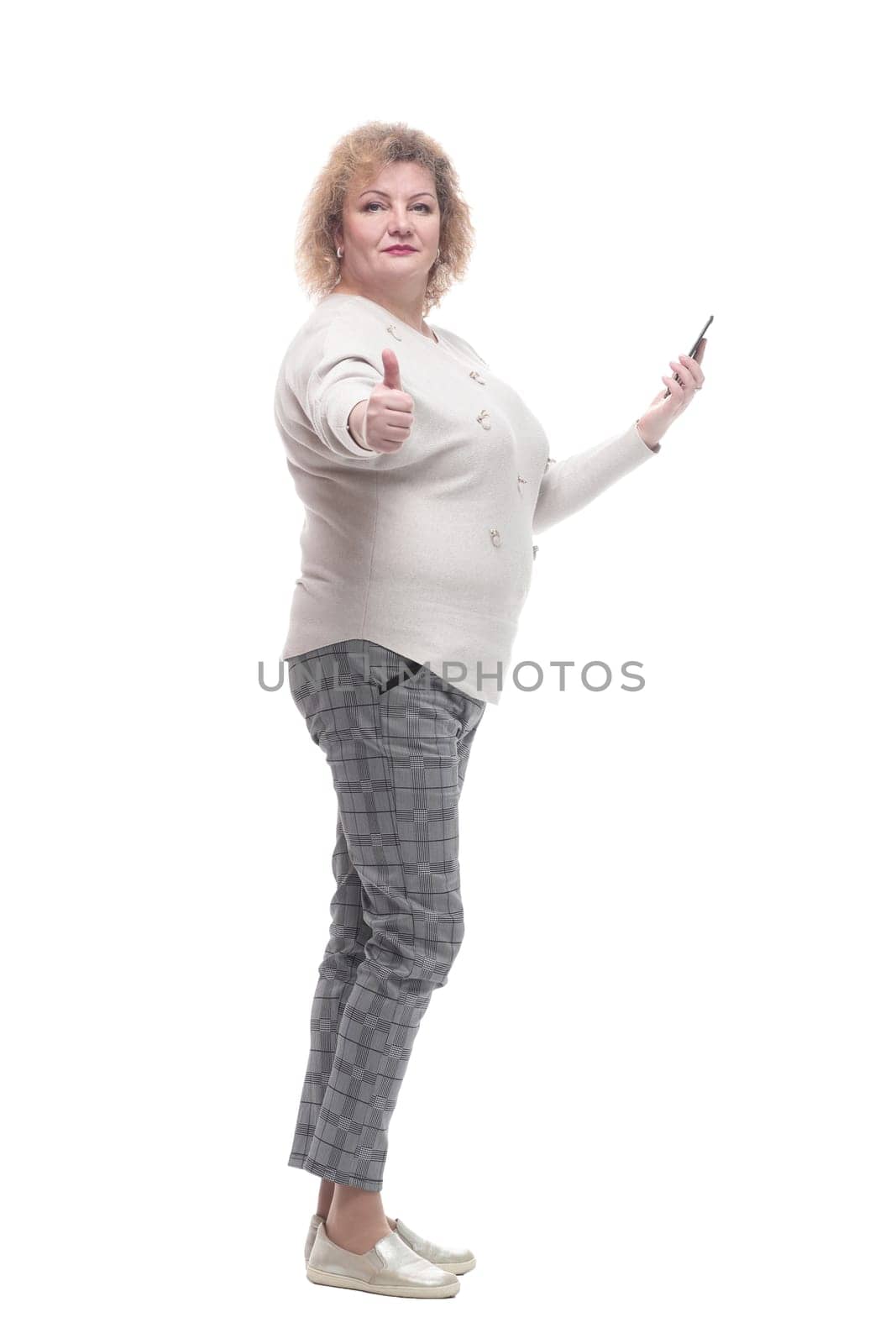 attractive adult woman with a smartphone. isolated on a white by asdf
