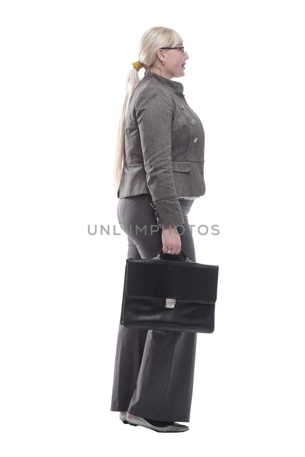 in full growth. friendly business woman with a leather briefcase. isolated on a white background