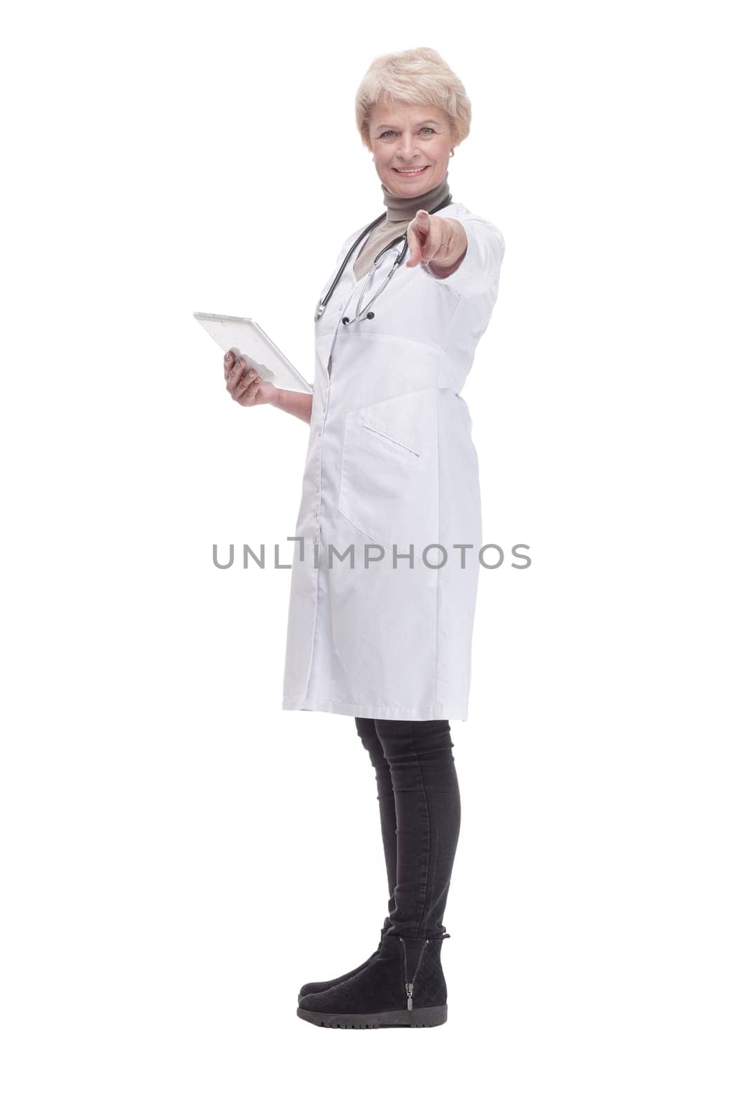 in full growth. modern woman doctor with a digital tablet . isolated on a white background.