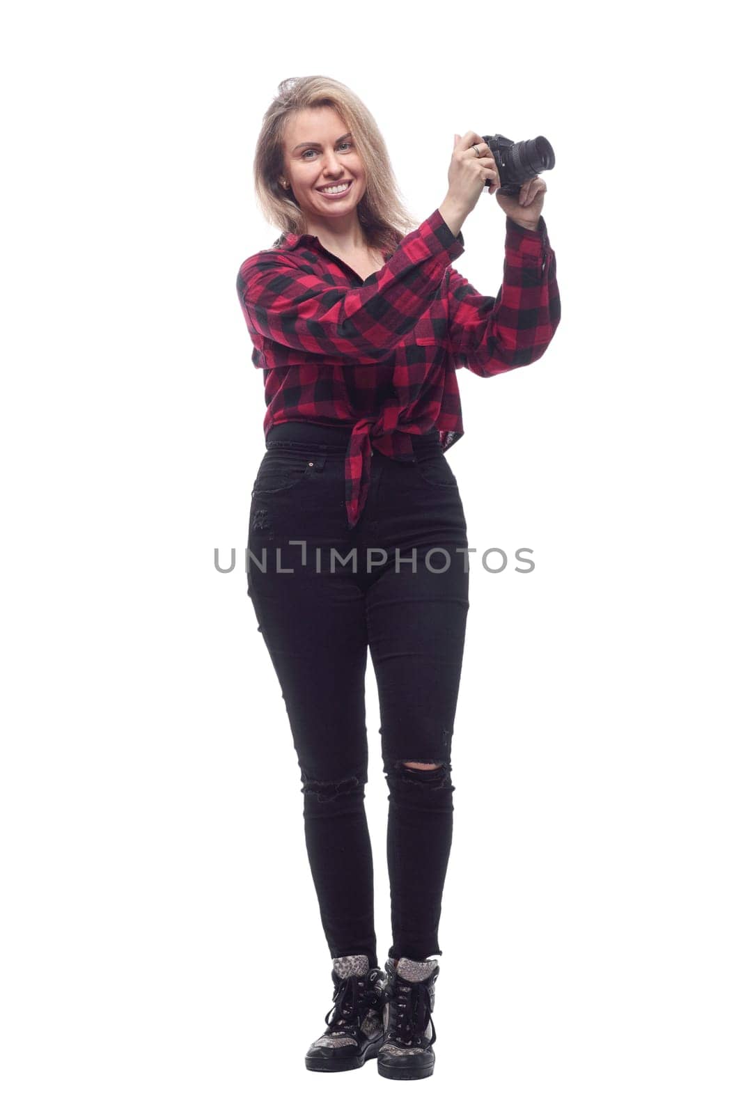 full-length.casual young woman with a camera. isolated on a white background.