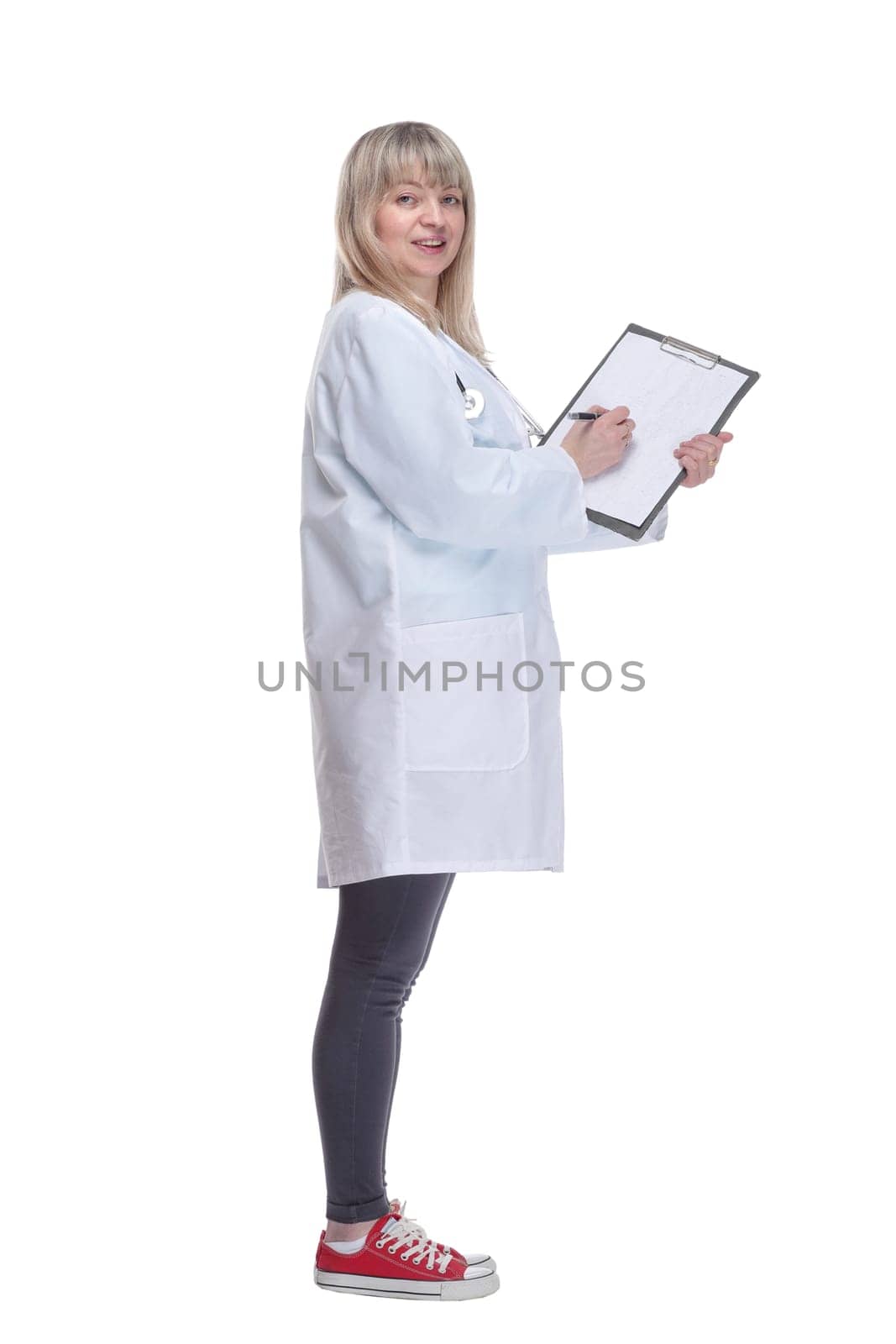 young female doctor making notes in a clipboard . by asdf